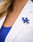 Person wearing a white blazer with a Kentucky Wildcats logo