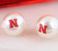 Nebraska Huskers Pearl Stud Earrings – Officially Licensed UNL Jewelry | Nebraska N Logo Studs