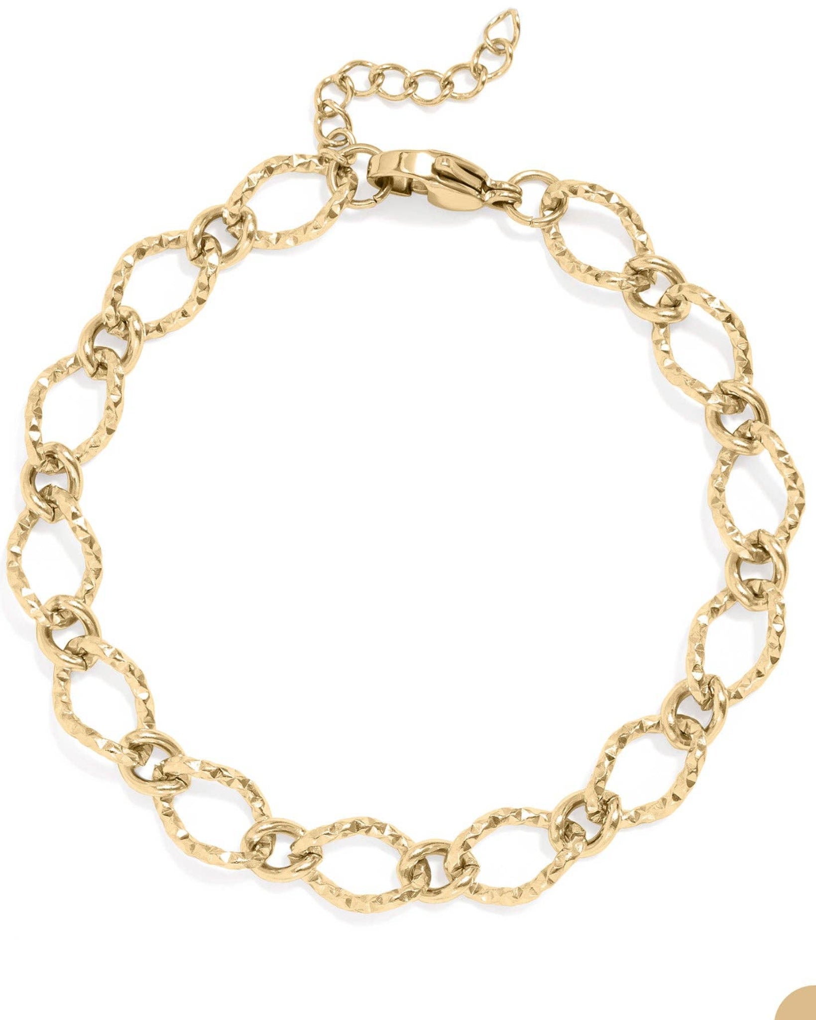 Gold hammered oval chain bracelet on a white background