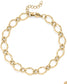 Gold hammered oval chain bracelet on a white background