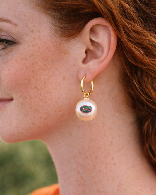 Florida Gators logo pearl hoop earrings worn on model with gold hoops