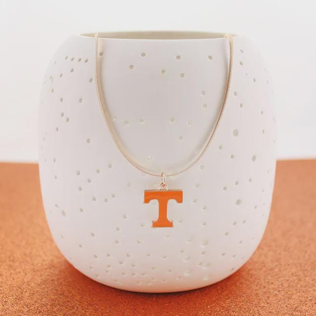 Tennessee Volunteers gold herringbone necklace with orange Power T pendant displayed on a white holder.
