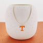 Tennessee Volunteers gold herringbone necklace with orange Power T pendant displayed on a white holder.