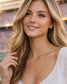 Woman wearing Tennessee Volunteers gold herringbone necklace with orange Power T pendant at a stadium.