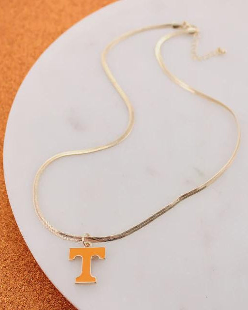 Tennessee Volunteers gold herringbone necklace with orange Power T pendant on white background.