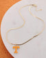 Tennessee Volunteers gold herringbone necklace with orange Power T pendant on white background.
